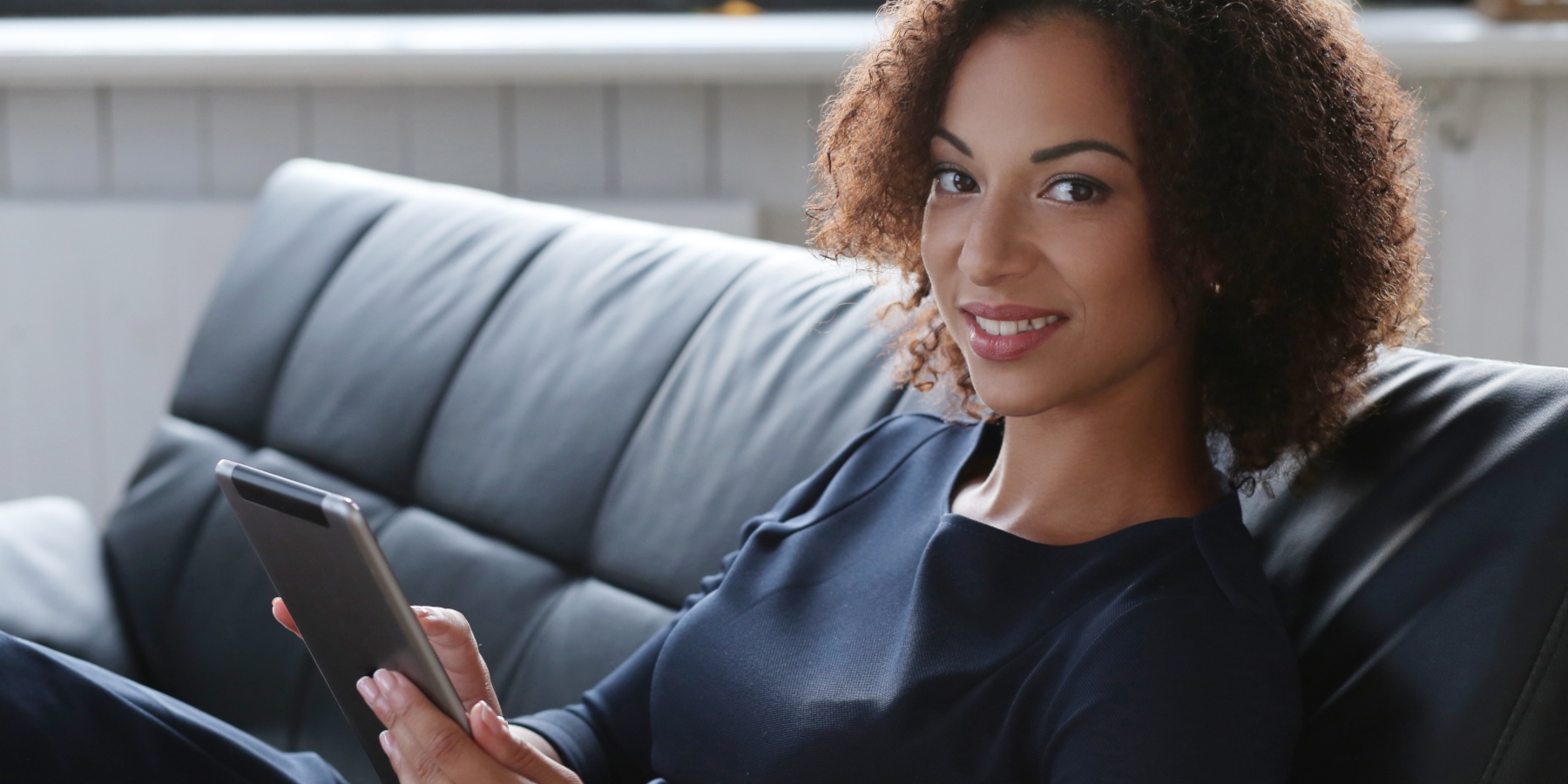 Office, lifestyle. Woman with African-American hairstyle